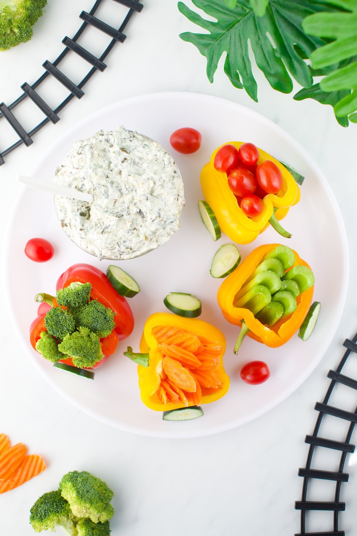 Cute vegetable train on a platter. Made with variety of bell peppers.