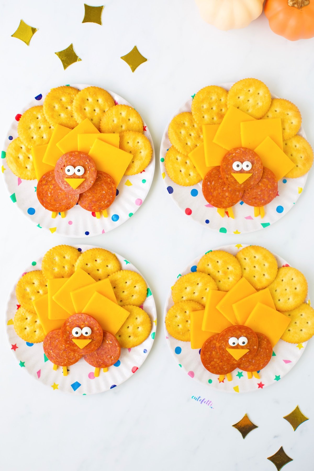 fun Thanksgiving snack, cute mini Turkey cheese plates served on confetti plates.