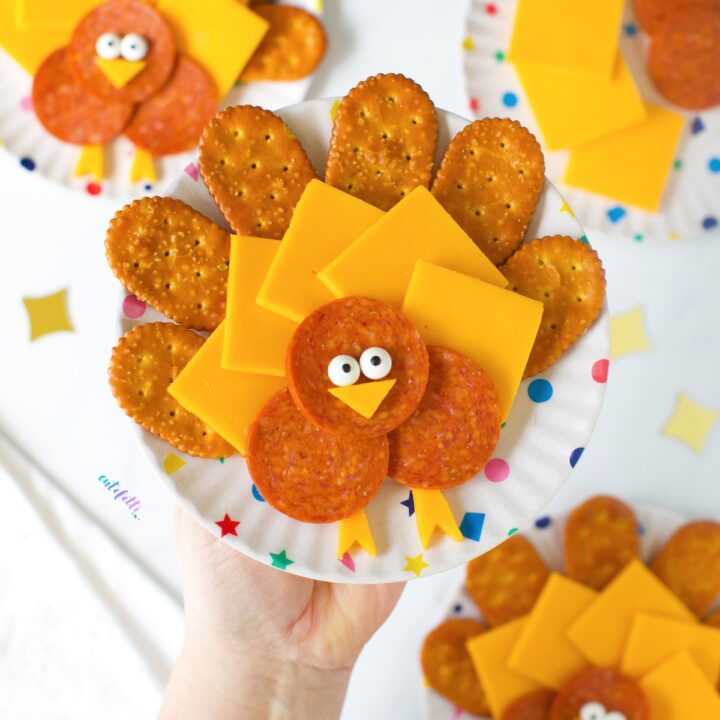 cute turkey cheese plates with crackers and pepperoni. Fun thanksgiving snack idea.