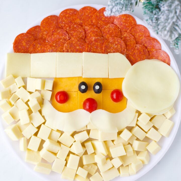 cute santa clause snack platter made with various cheeses