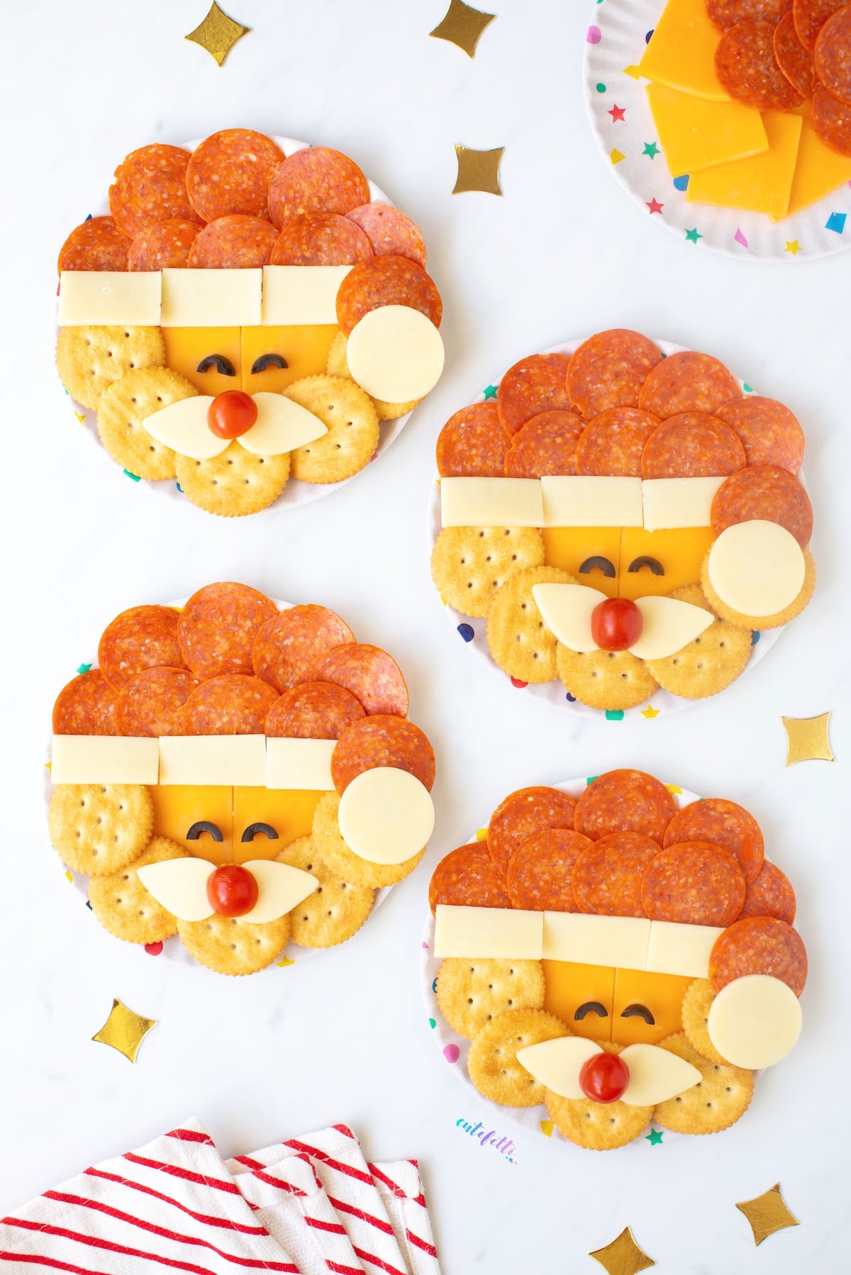 Santa Snack Plates with cheese, crackers and pepperoni. So cute.