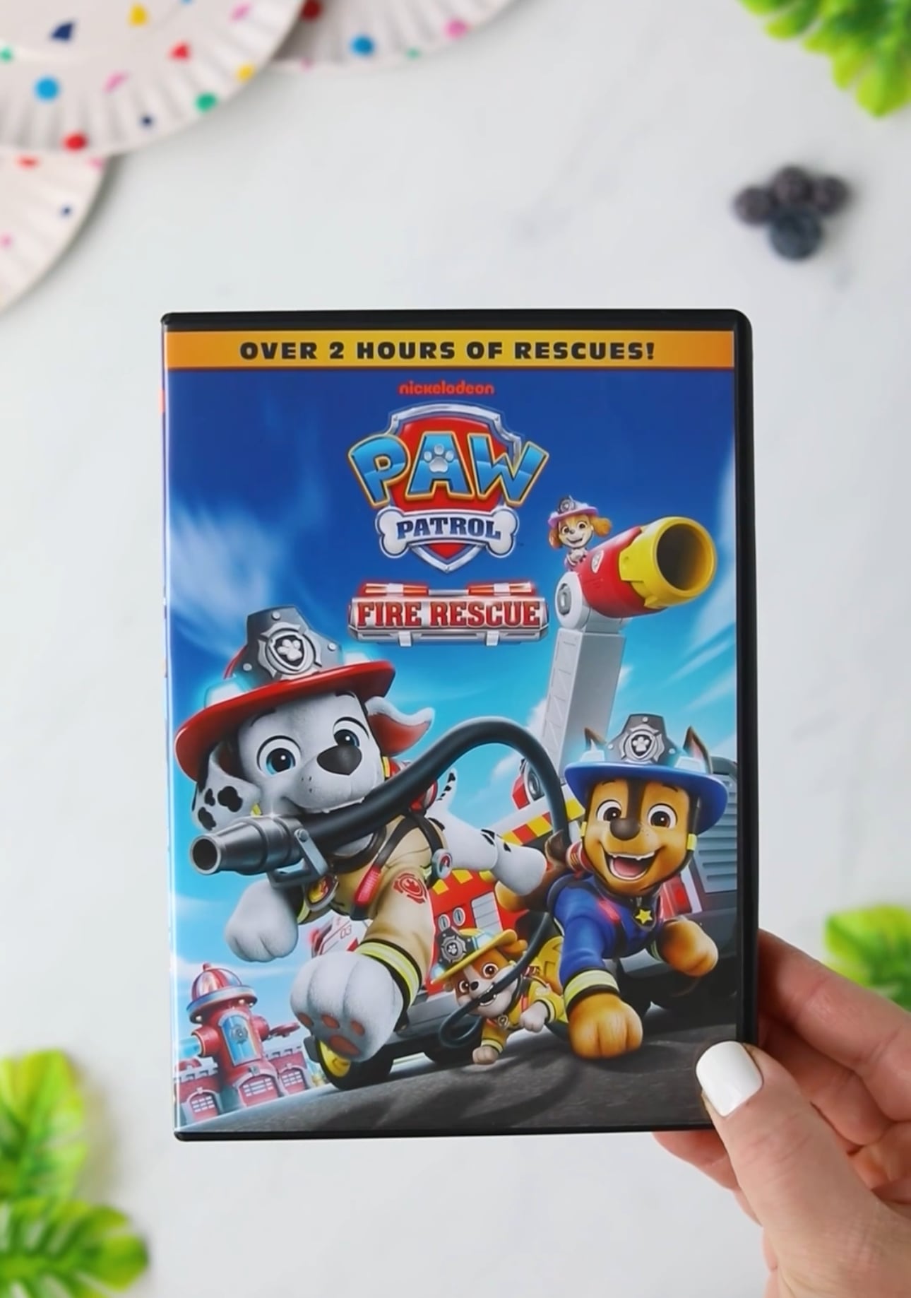 PAW Patrol: Fire Rescue DVD in hand.
