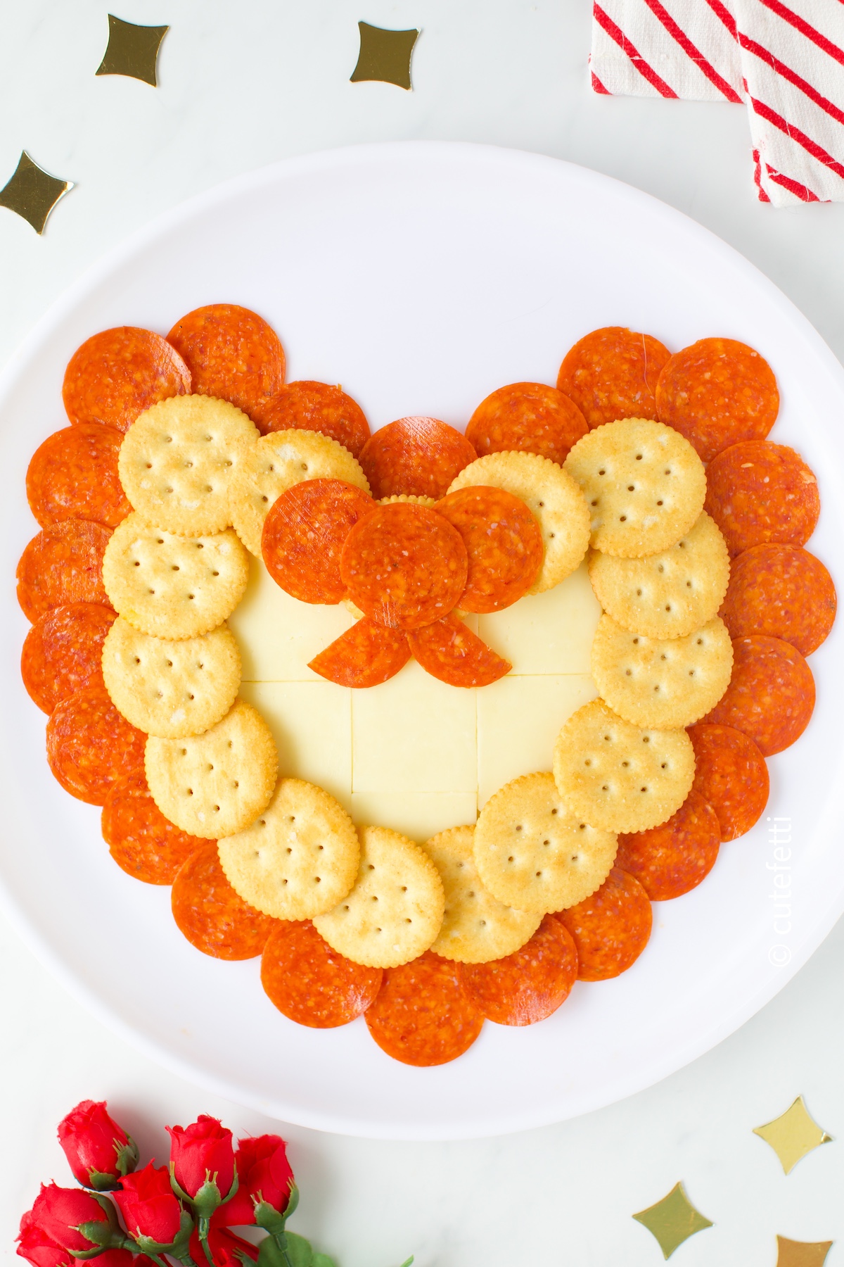 pepperoni and cheese heart with a pepperoni bow