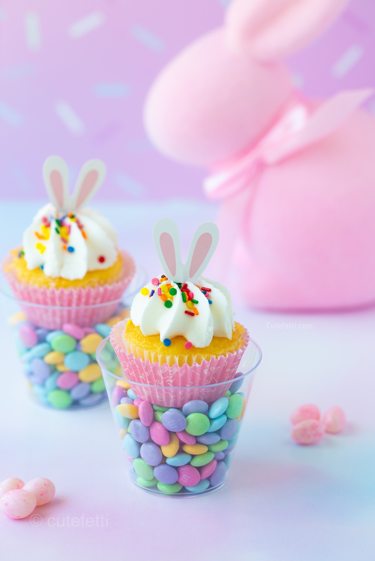 pretty bunny cupcake candy cups made for easter. Add pastel candies and a bunny cupcake topper.