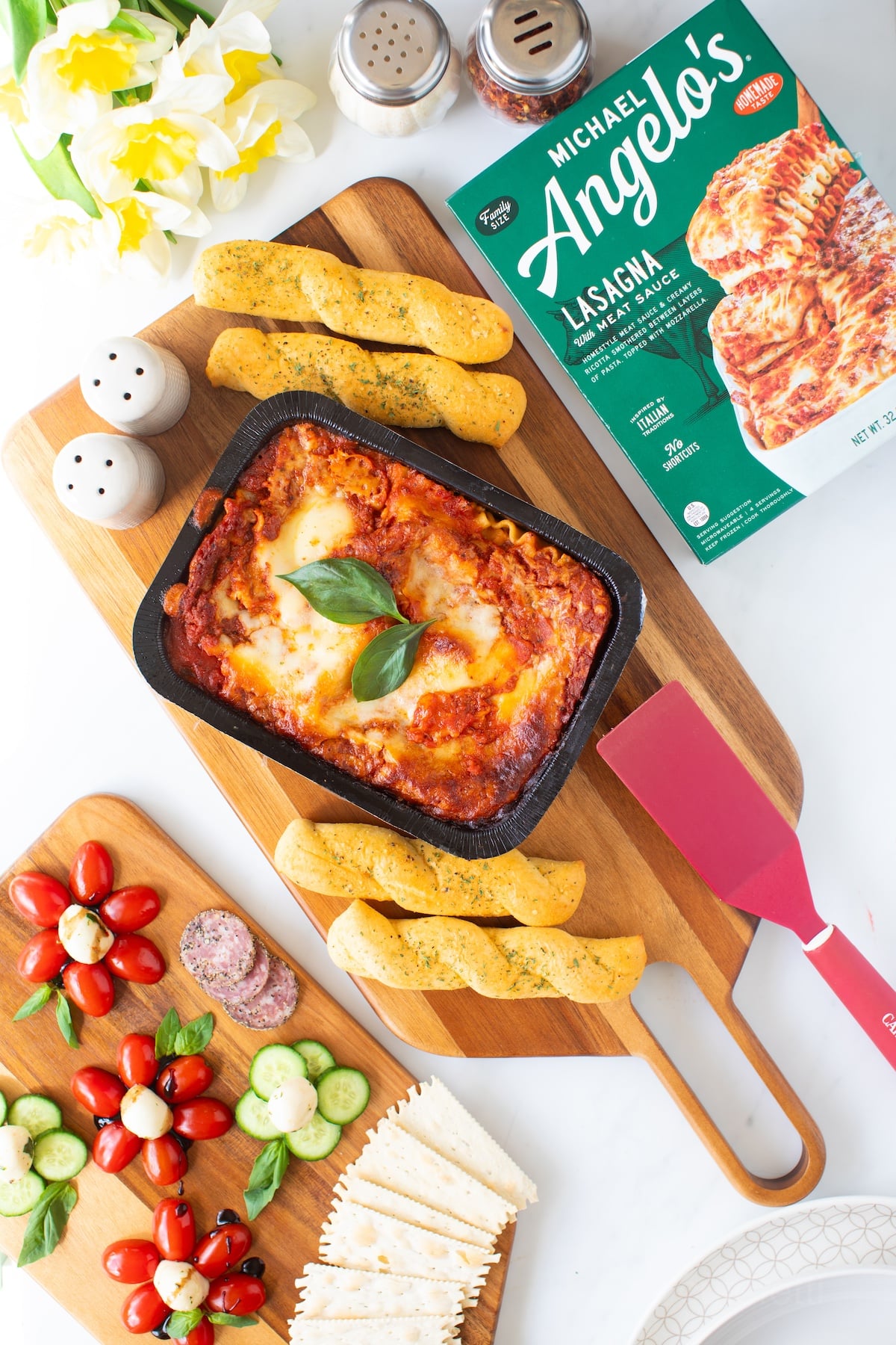 3 course meal with frozen lasagna, caprese flower appetizer, breadsticks and dessert