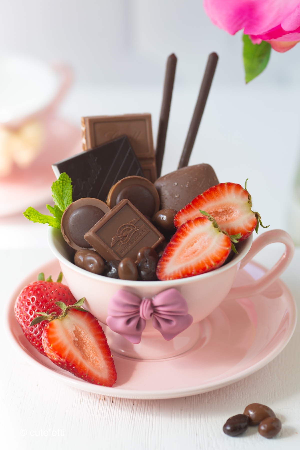 Teacup Dessert Charcuterie that showcases variety of chocolate sweet treats and strawberries.