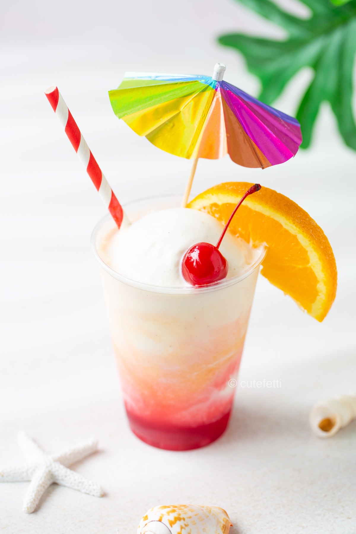 dreamy and creamy sunset floats with cherry red combined with orange juice orange colors swirled with vanilla ice cream.